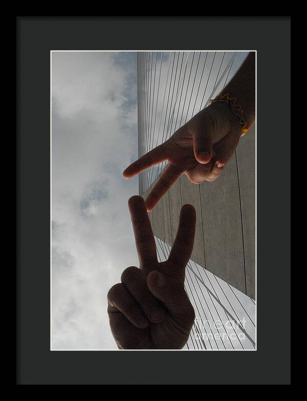 Peace Gesture Against Skyscraper - Framed Print