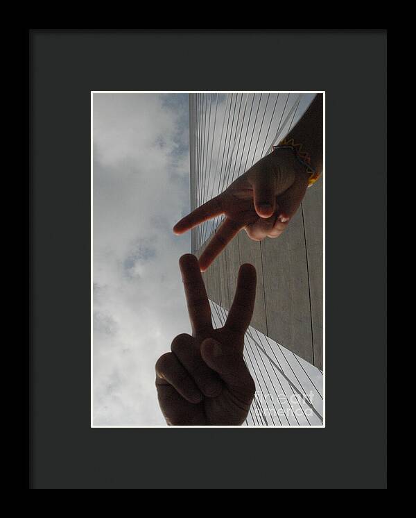 Peace Gesture Against Skyscraper - Framed Print