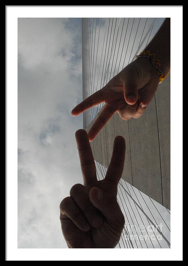 Peace Gesture Against Skyscraper - Framed Print