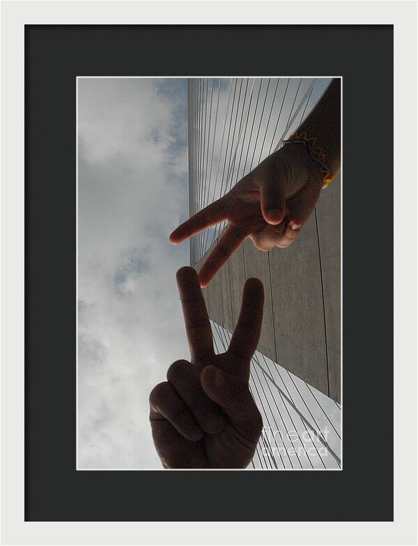 Peace Gesture Against Skyscraper - Framed Print