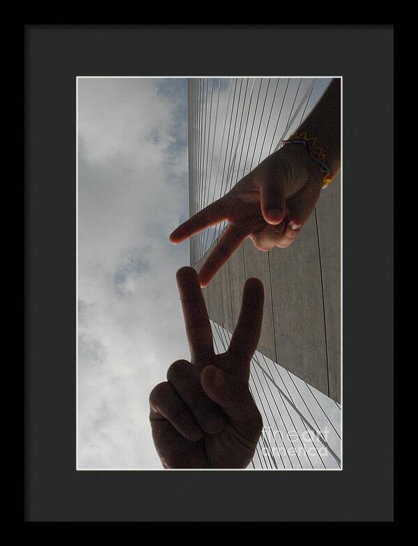 Peace Gesture Against Skyscraper - Framed Print