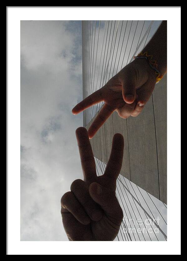 Peace Gesture Against Skyscraper - Framed Print