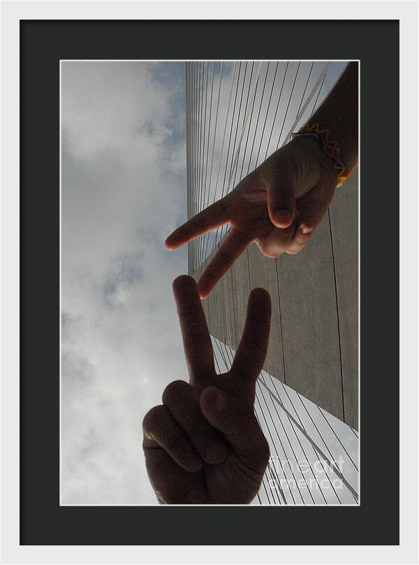 Peace Gesture Against Skyscraper - Framed Print
