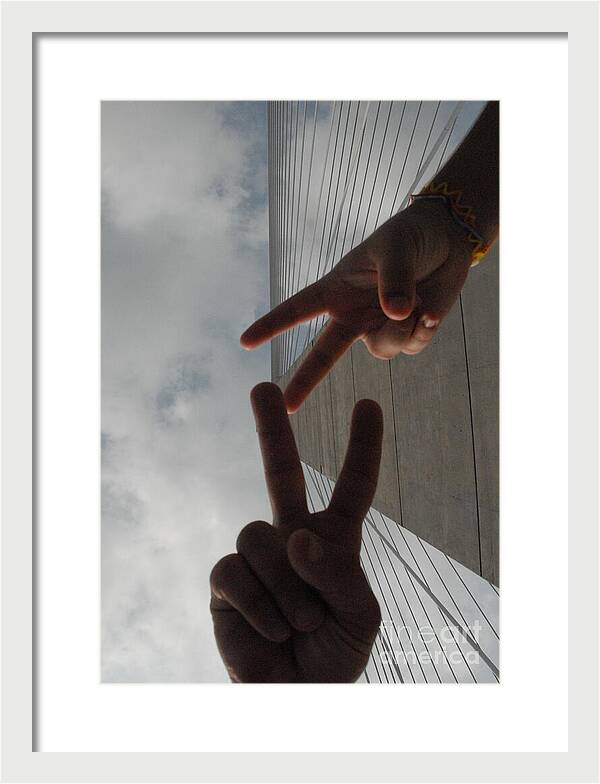 Peace Gesture Against Skyscraper - Framed Print