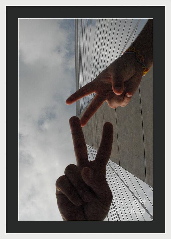 Peace Gesture Against Skyscraper - Framed Print