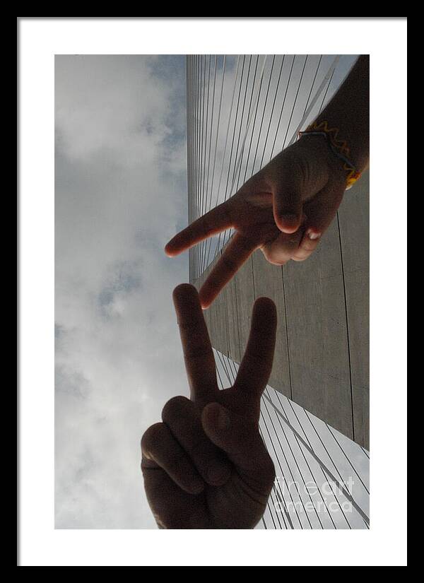 Peace Gesture Against Skyscraper - Framed Print