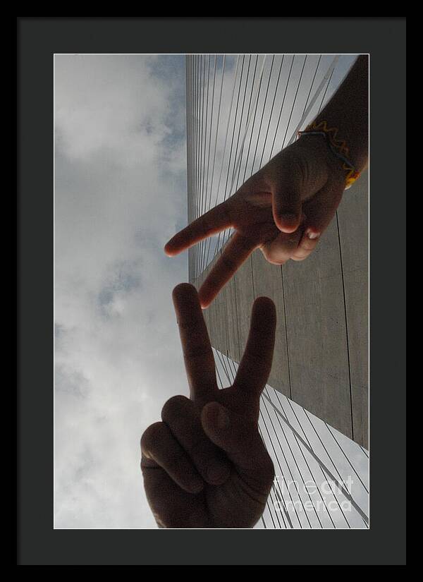 Peace Gesture Against Skyscraper - Framed Print