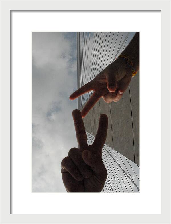 Peace Gesture Against Skyscraper - Framed Print