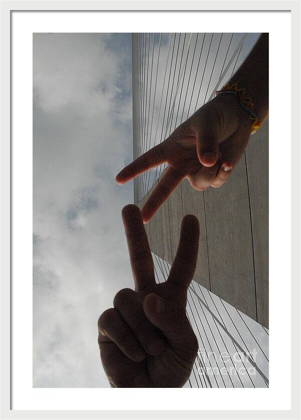 Peace Gesture Against Skyscraper - Framed Print