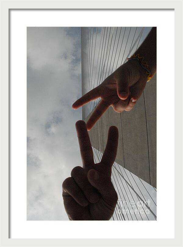 Peace Gesture Against Skyscraper - Framed Print