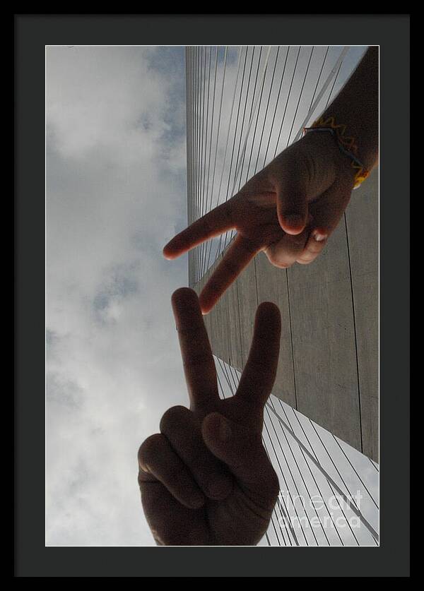 Peace Gesture Against Skyscraper - Framed Print