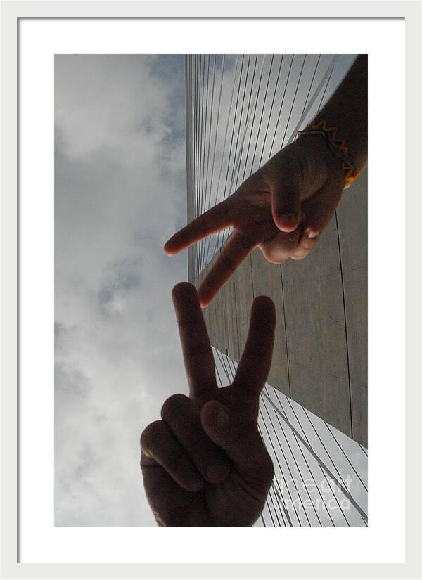 Peace Gesture Against Skyscraper - Framed Print