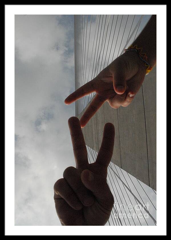 Peace Gesture Against Skyscraper - Framed Print