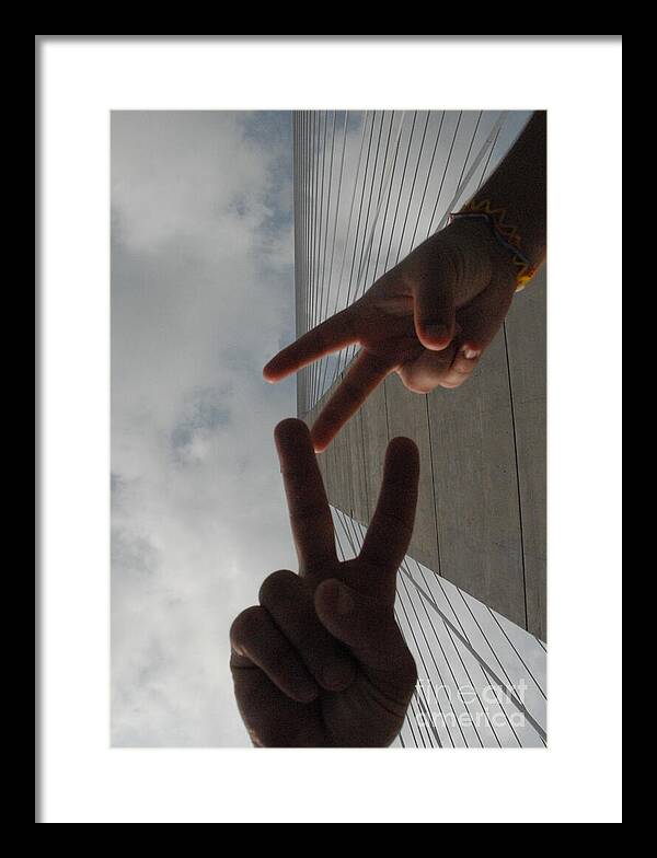 Peace Gesture Against Skyscraper - Framed Print