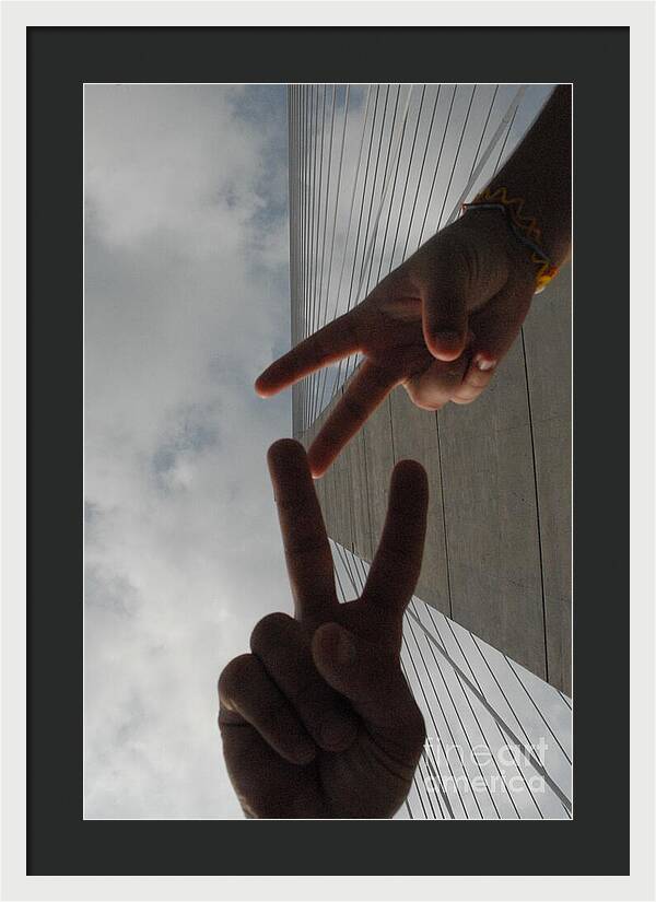 Peace Gesture Against Skyscraper - Framed Print