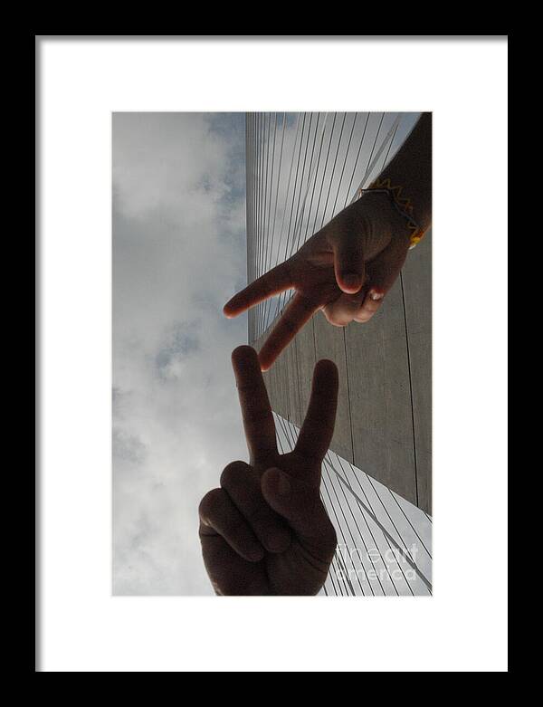 Peace Gesture Against Skyscraper - Framed Print