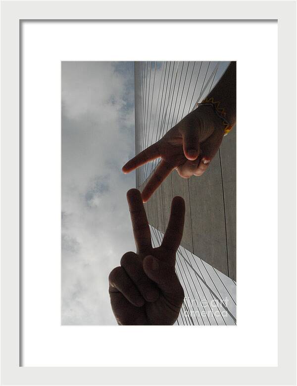 Peace Gesture Against Skyscraper - Framed Print