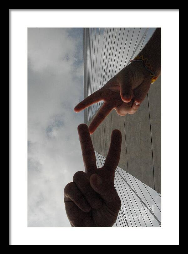 Peace Gesture Against Skyscraper - Framed Print