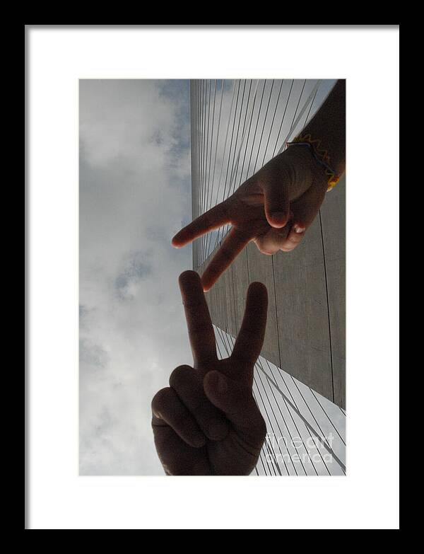 Peace Gesture Against Skyscraper - Framed Print