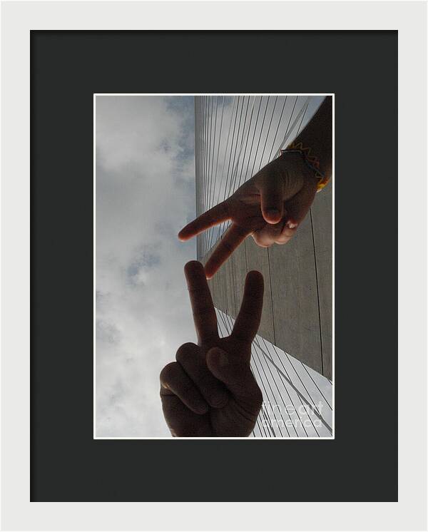 Peace Gesture Against Skyscraper - Framed Print
