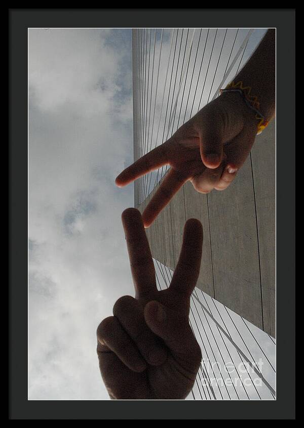 Peace Gesture Against Skyscraper - Framed Print