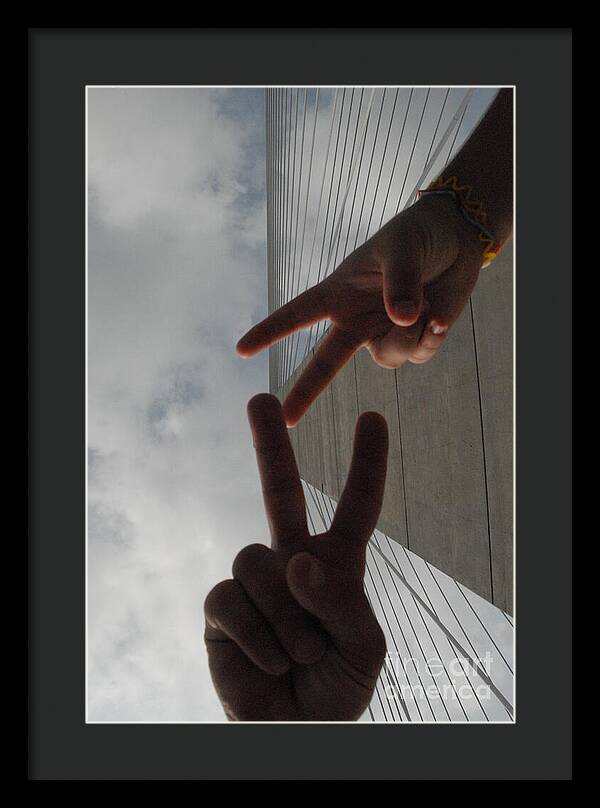 Peace Gesture Against Skyscraper - Framed Print