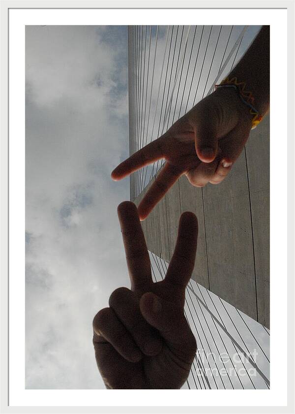 Peace Gesture Against Skyscraper - Framed Print