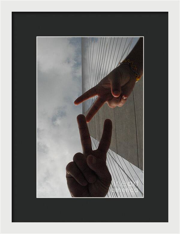 Peace Gesture Against Skyscraper - Framed Print