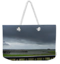 Stormy Sky Over Coastal Pier - Weekender Tote Bag